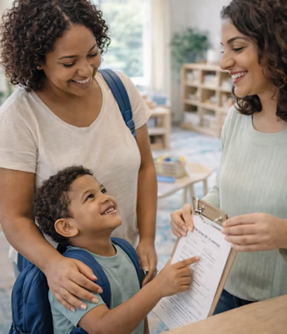 Two adult women with a young boy in a school setting