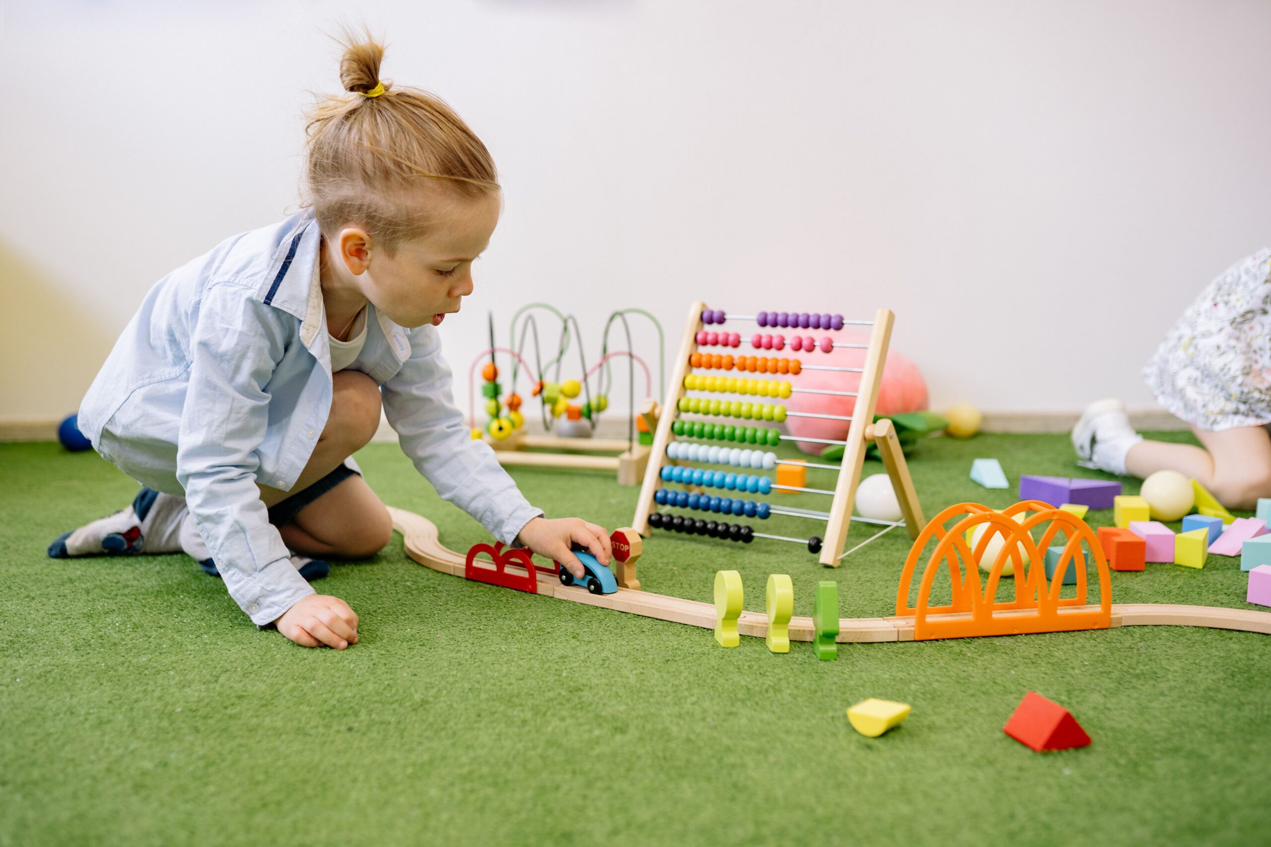 Child exploring colorful blocks and play materials